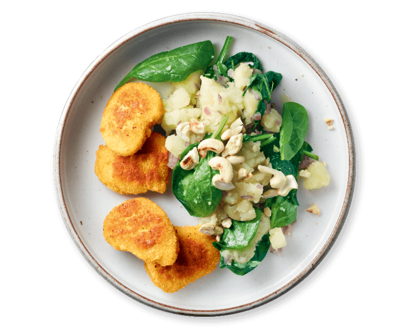 Vegetarische nuggets met spinaziepuree en cashewnoten