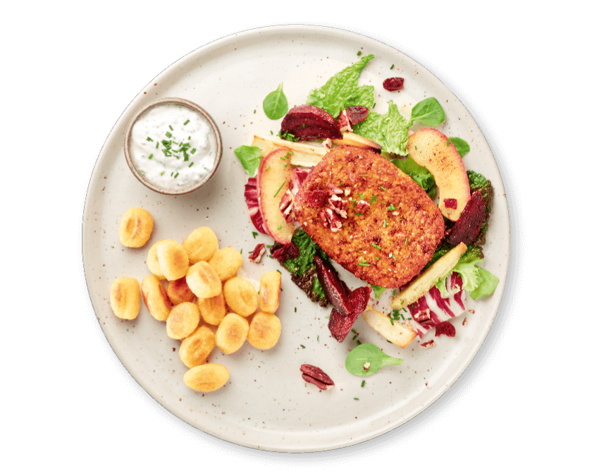Herfstsalade met appel, hazelnootburger en gebakken gnocchi